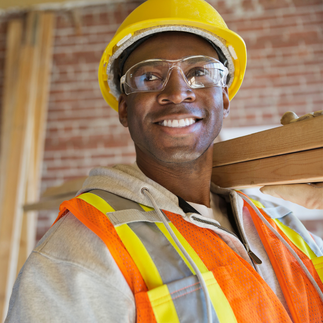 tradie on site carrying heavy materials